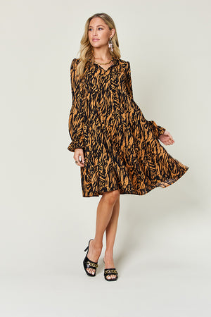 Living the Life Full Size Printed Ruffle Hem Long Sleeve Dress